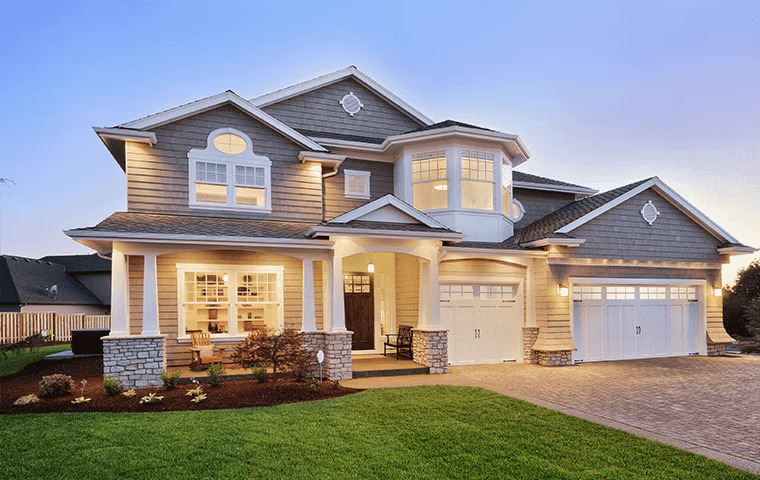 2-story house with a well-kept lawn in Frisco, TX