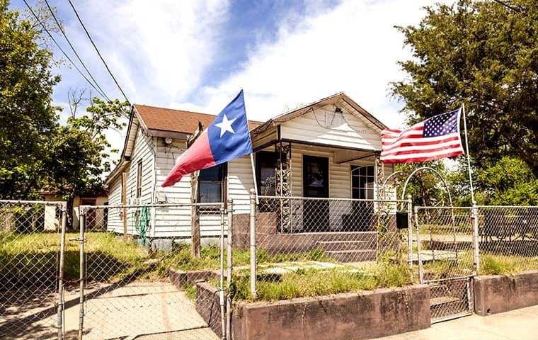 single-family house that needs yard work in Flower Mound, TX